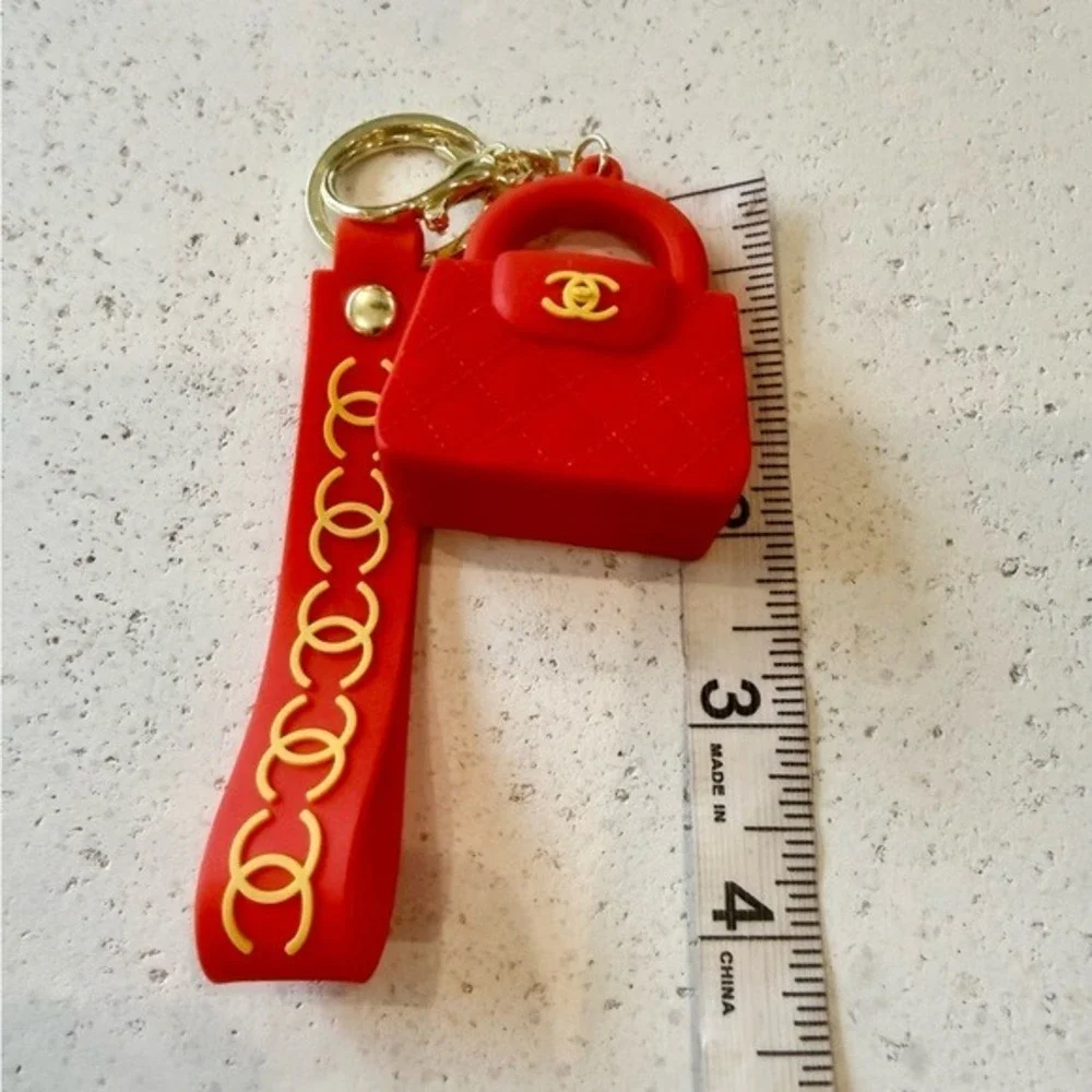 NEW FASHION BAG CHARMS KEY CHAINS. NWOT RED ORANGE /‎ GOLD